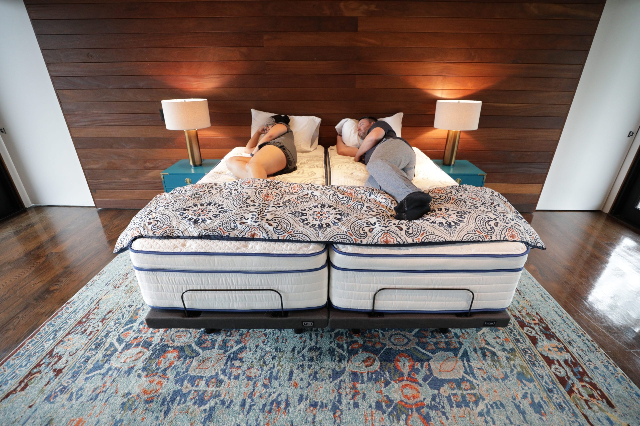 Couple sleeping on split king bed