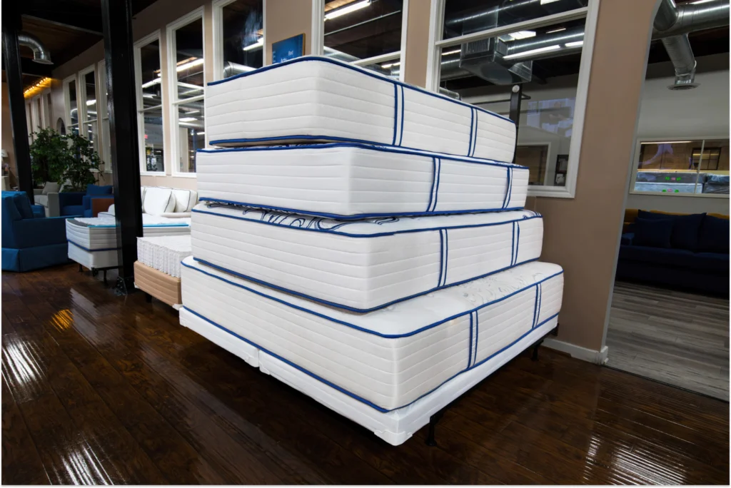 Stack of mattresses in the Texas Mattress Makers showroom.