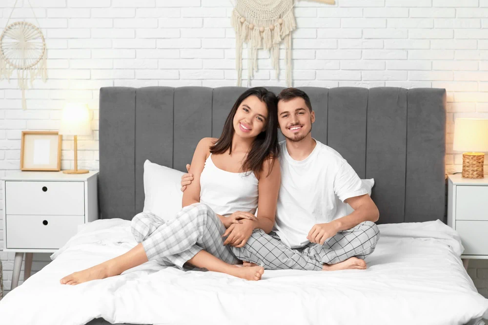 Smiling couple on a sustainable mattress